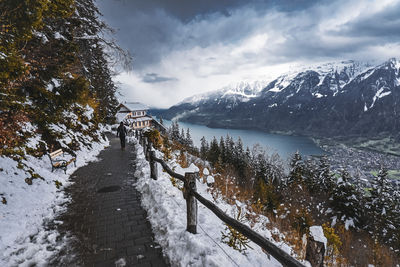 Scenic view of snow covered mountains against sky