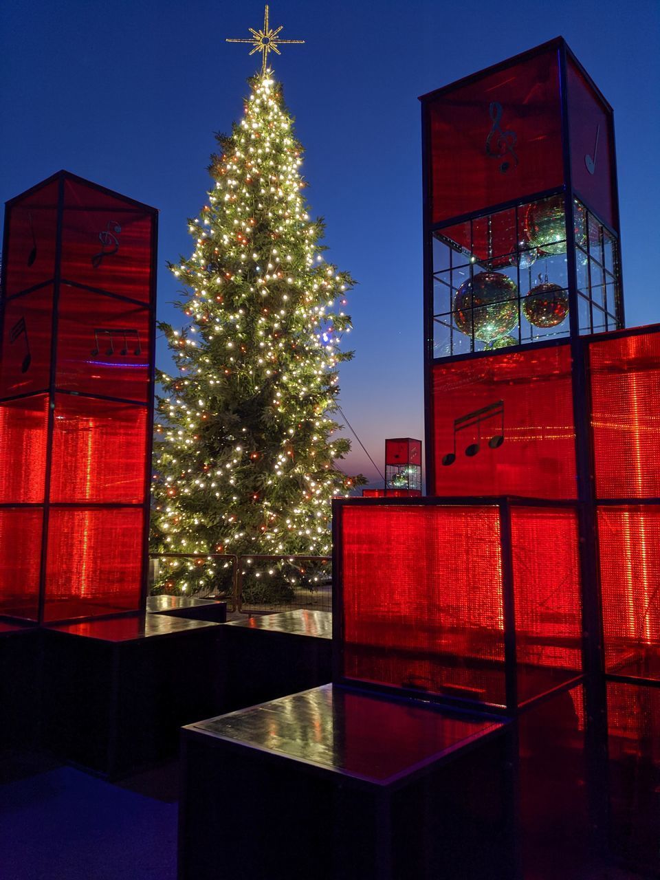 ILLUMINATED CHRISTMAS TREE BY BUILDING