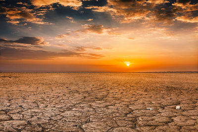 Scenic view of sunset over land