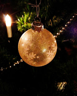 Close-up of illuminated christmas tree at night