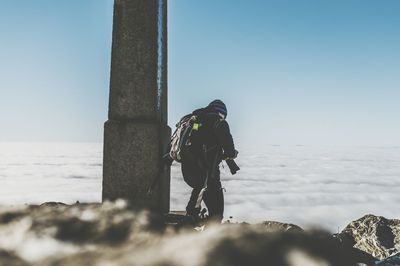 Man in sea against clear sky