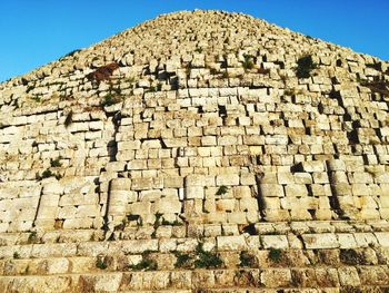 Low angle view of old ruins against sky