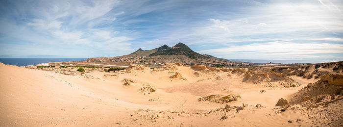 Panoramic view of desert against sky