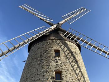 Low angle view of building against clear blue sky