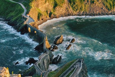 High angle view of rocks by sea