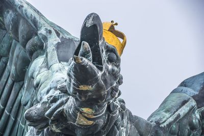Low angle view of statue against sky