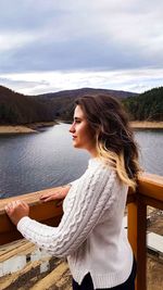 Side view of woman looking away while standing at observation point