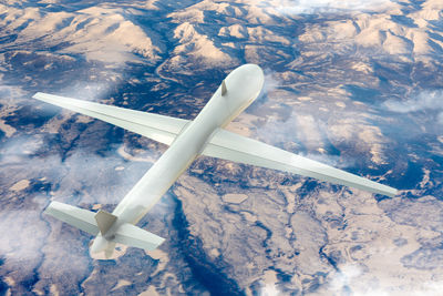 Aerial view of airplane flying over landscape