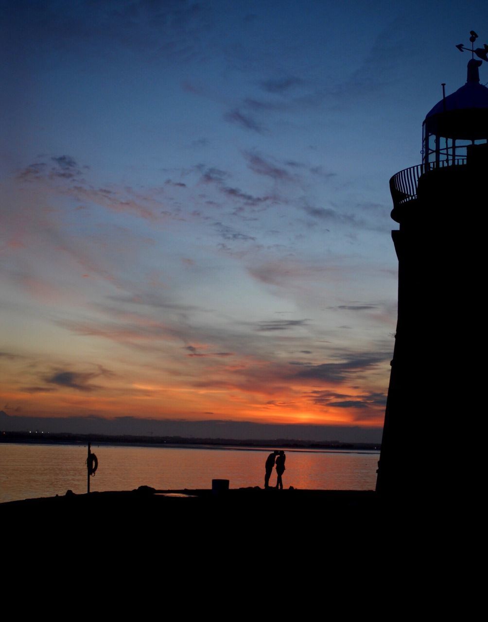 sunset, silhouette, sea, water, scenics, horizon over water, tranquil scene, tranquility, beach, calm, sky, beauty in nature, idyllic, orange color, cloud, nature, outline, majestic, cloud - sky, dark, shore, outdoors, ocean, remote, solitude, sun, moody sky, dramatic sky, coastline, atmospheric mood, no people