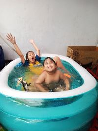 Portrait of smiling boy in water