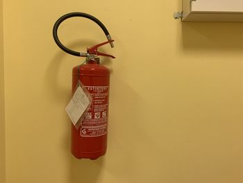 Close-up of electric lamp against wall