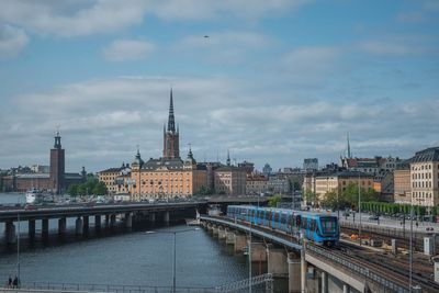 View of bridge over river in city