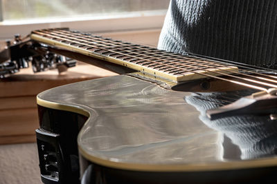 Close-up of guitar on table