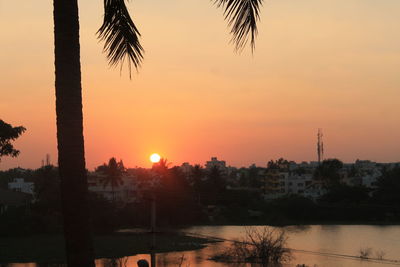 Silhouette of city during sunset