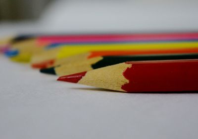 Close-up of multi colored pencils on table