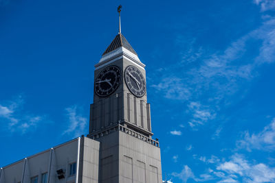 Low angle view of clock tower against sky