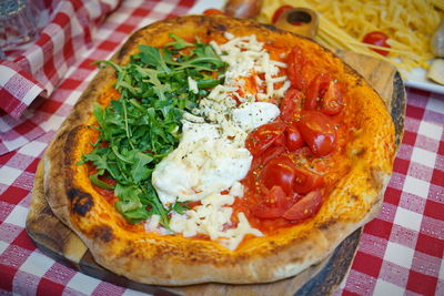 High angle view of pizza served in plate