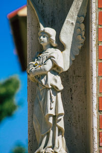 Low angle view of angel statue