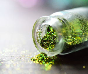 Close-up of green container on table