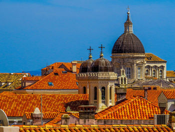 View of buildings against blue sky