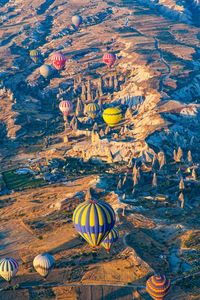 High angle view of hot air balloons flying above cappadocia