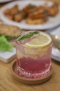 Close-up of cocktail in glass on table