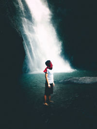 Full length of woman standing in water