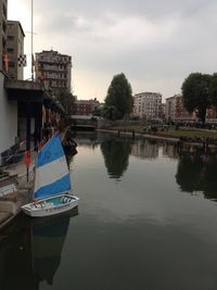 Boats moored in river