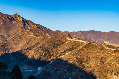 The great wall. scenic view of mountains against clear blue sky