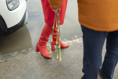 Red boots. red women's clothing. meeting people. romantic mood.