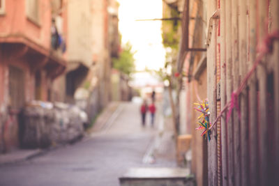 Close-up of alley amidst buildings in city