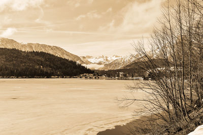 Scenic view of landscape against sky during winter