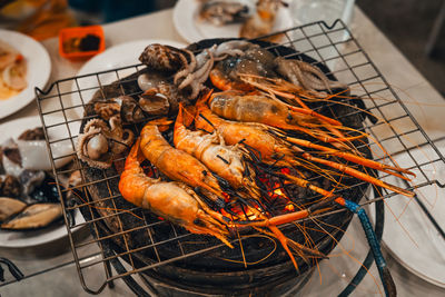 Close-up of seafood on barbecue grill