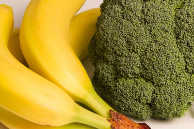 Close-up of bananas and broccoli