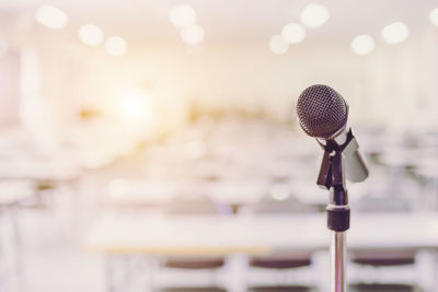 Close-up of microphone in lecture hall