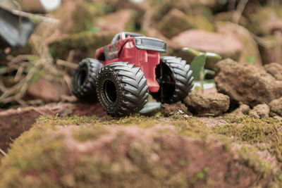 Close-up of tough toy car on difficult terrain