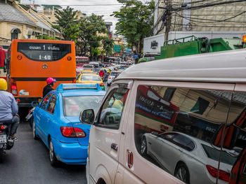 Vehicles on road along buildings