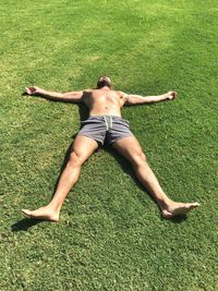 Full length of a man lying on grass