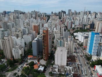 High angle view of city buildings against sky