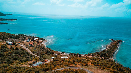 High angle view of sea against blue sky