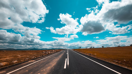 Empty road along landscape