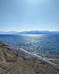 Group of people on beach against sky