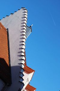 Low angle view of building against clear blue sky