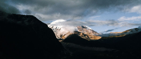 Scenic view of snowcapped mountains against sky