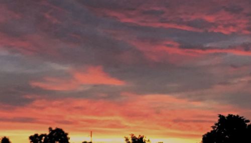 Low angle view of cloudy sky at sunset