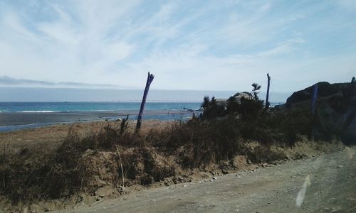 Scenic view of beach against sky