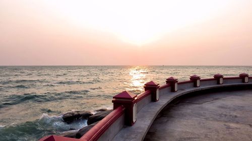 Scenic view of sea against clear sky during sunset