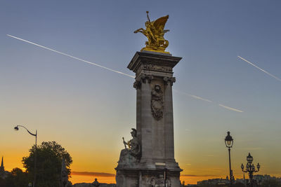 Low angle view of statue against sky