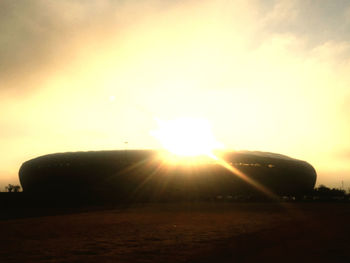 Sunlight streaming through clouds during sunset