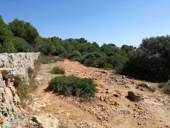 Scenic view of land against clear blue sky